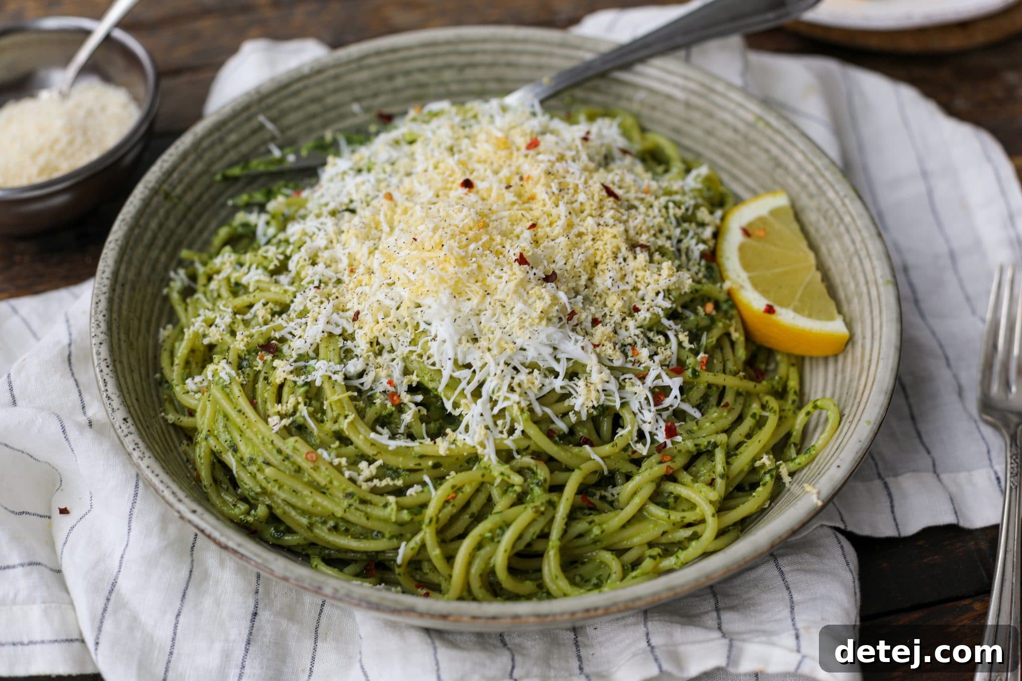 Delicious Grated Egg Pesto Pasta in a bowl, ready to serve. Healthyish Foods.