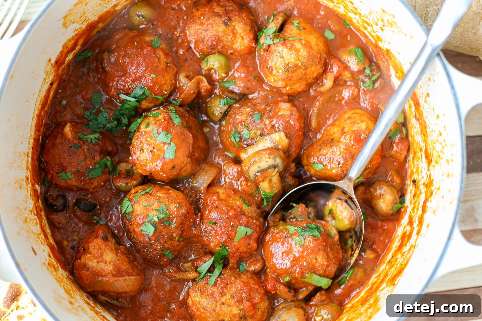 Delicious and juicy Chicken Cacciatore Meatballs served in a rich, savory sauce with olives, mushrooms, and herbs. A perfect quick dinner idea from Healthyish Foods.