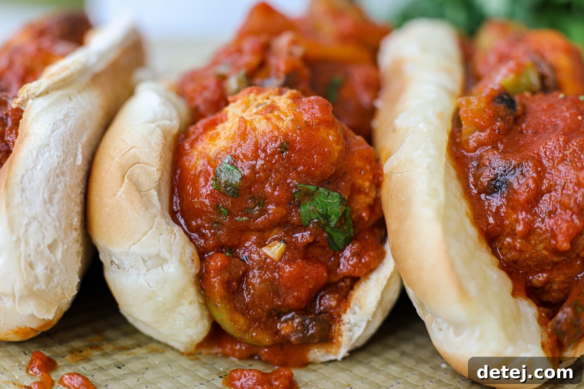 A serving of finished Chicken Cacciatore Meatballs, garnished with fresh herbs, ready to be enjoyed. A testament to easy and delicious home cooking.