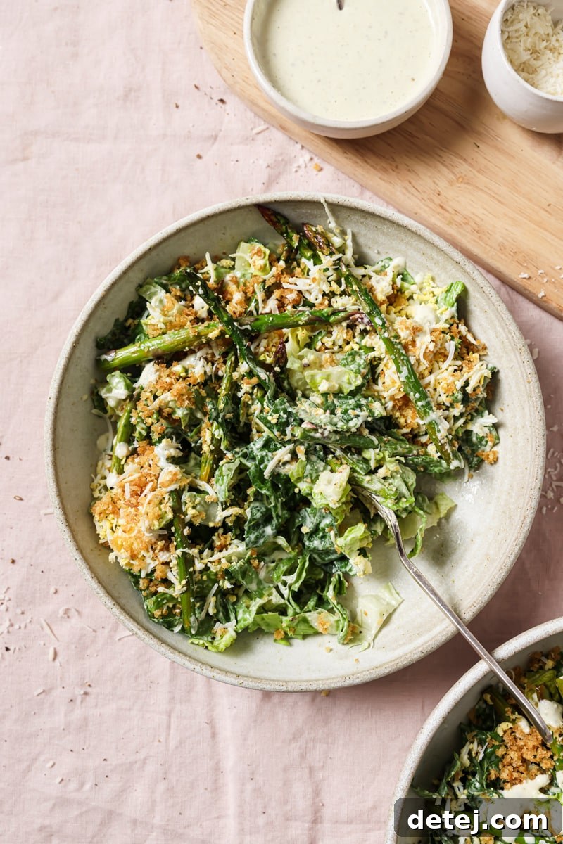 caesar salad with asparagus, grated egg and panko. 