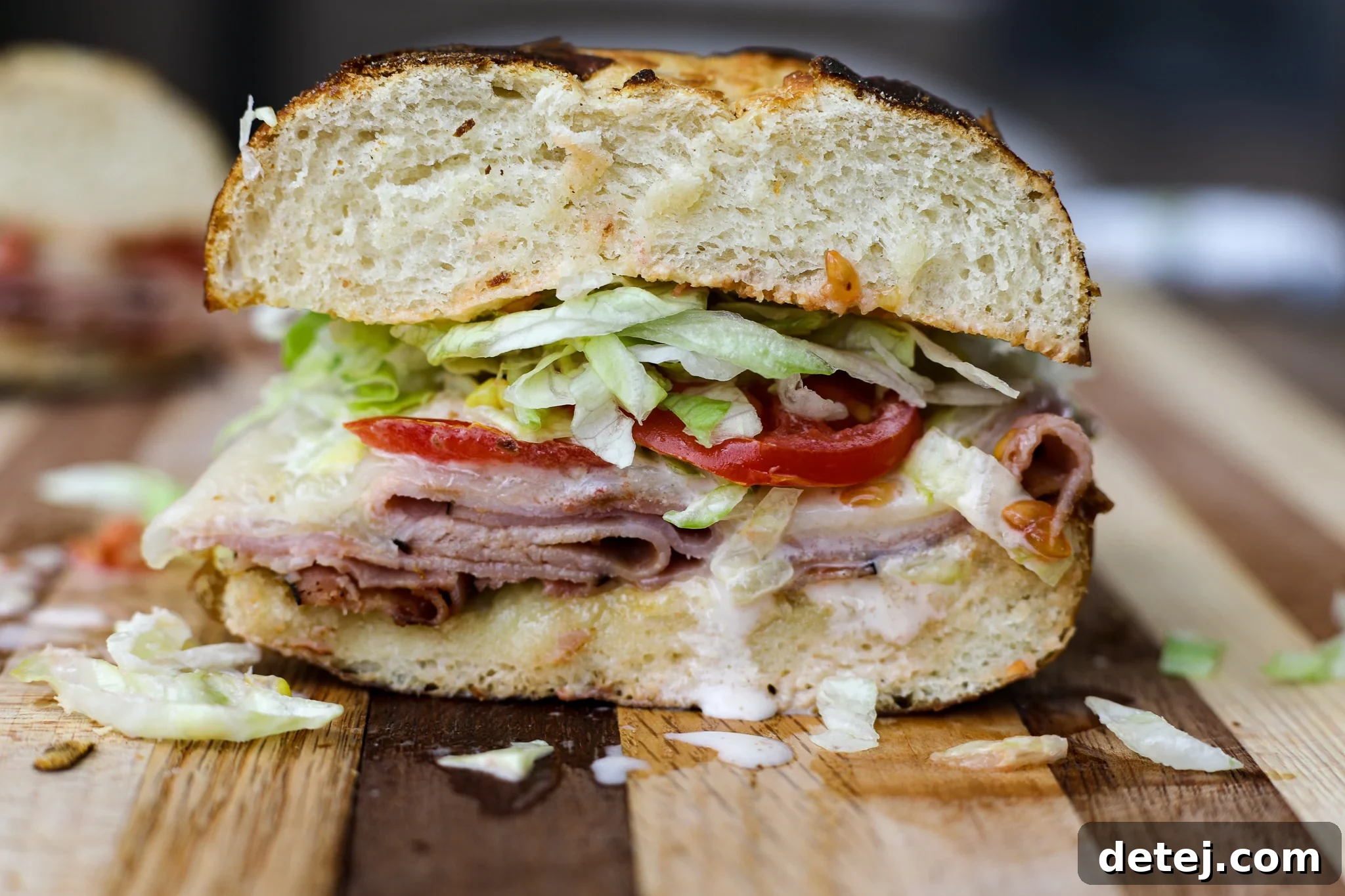 Decadent Black Forest Stack 2 Irresistible Black Forest Sandwich with gooey melted Swiss cheese, fresh lettuce, ripe tomato, and homemade honey mustard, served on a perfectly toasted pretzel bun.