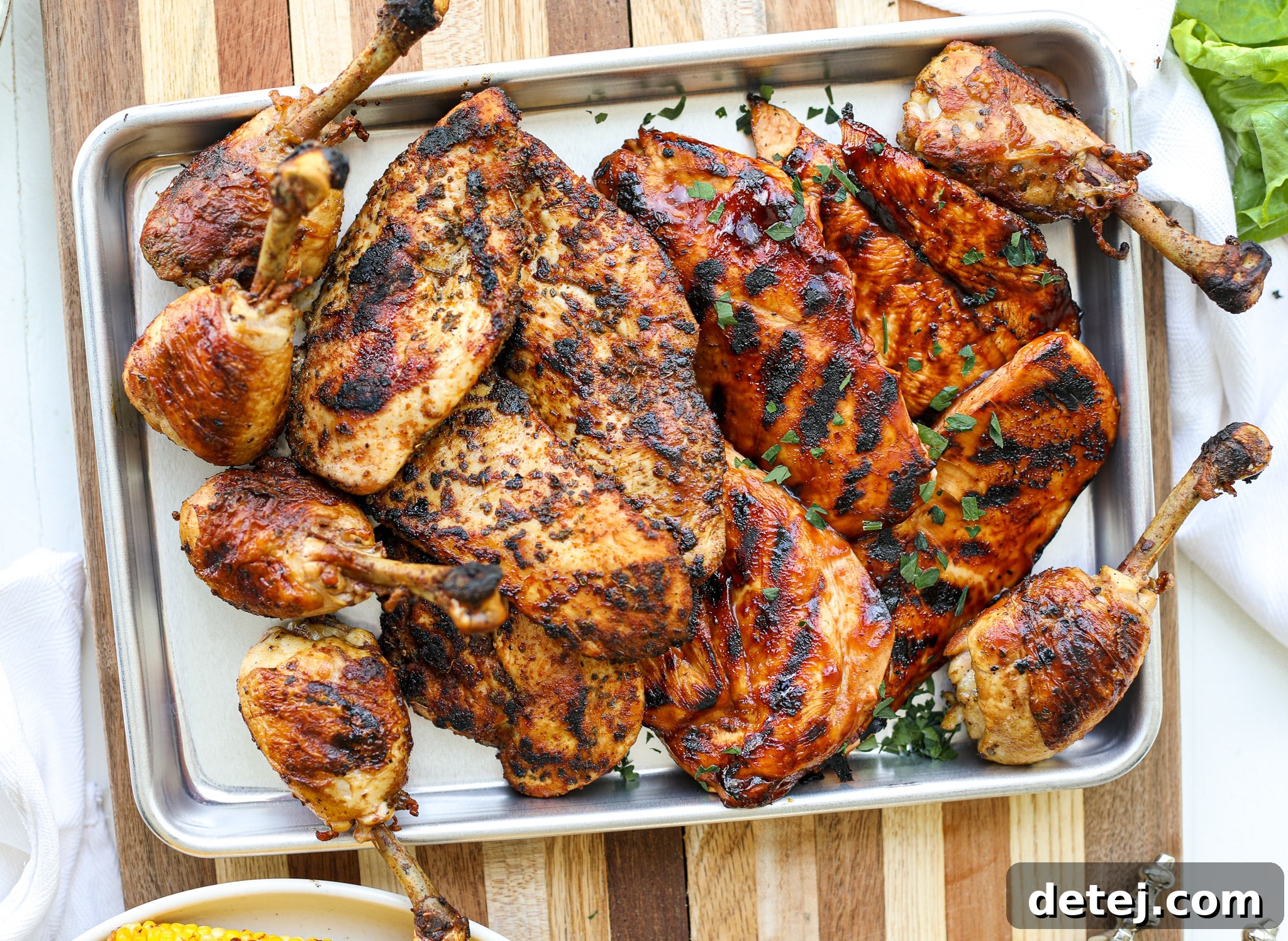 A beautifully arranged platter of BBQ, Blackened, and Traditional Grilled Chicken, ready for serving.