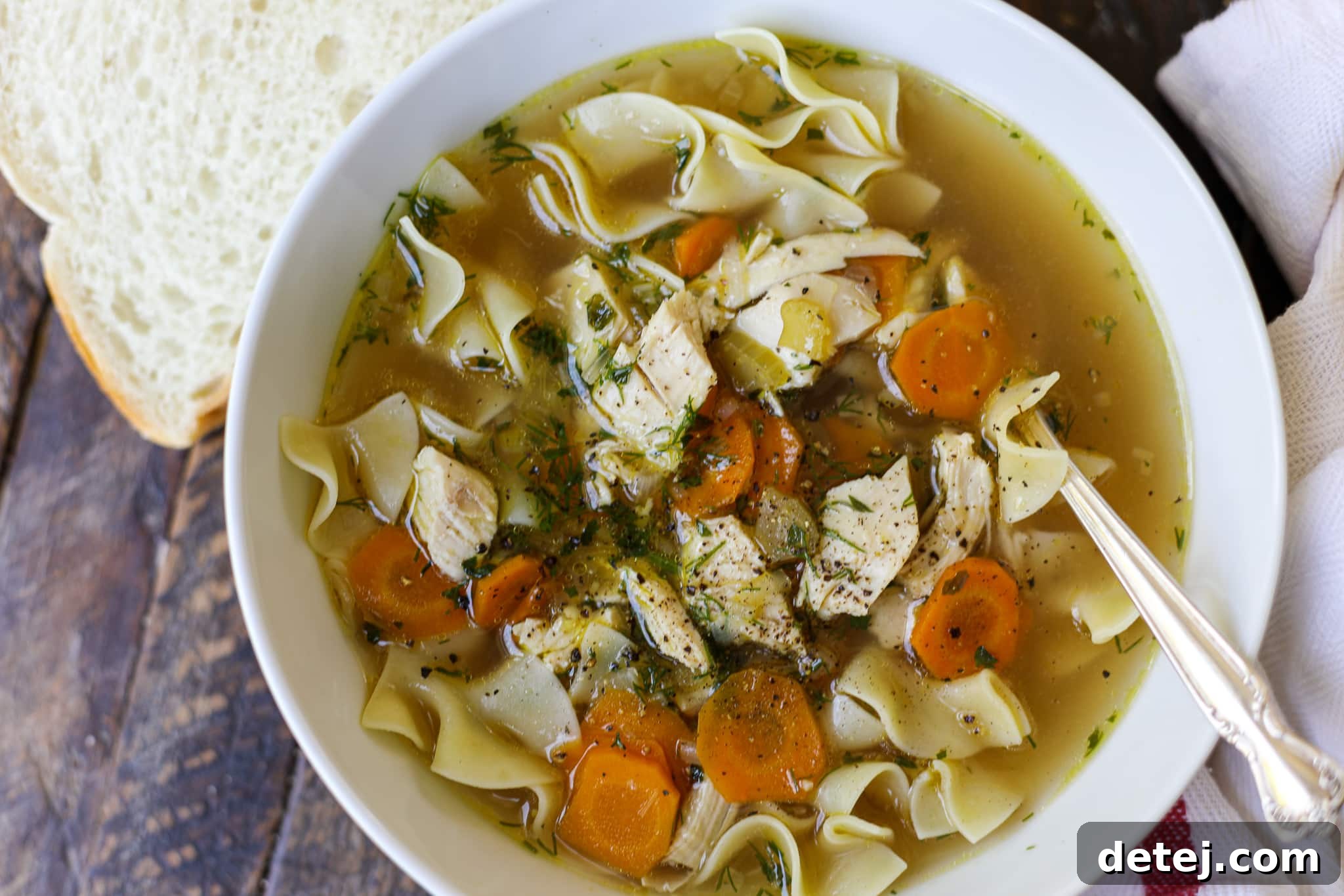 Hearty Bone Broth Chicken Noodle Soup with fresh herbs, ready to serve