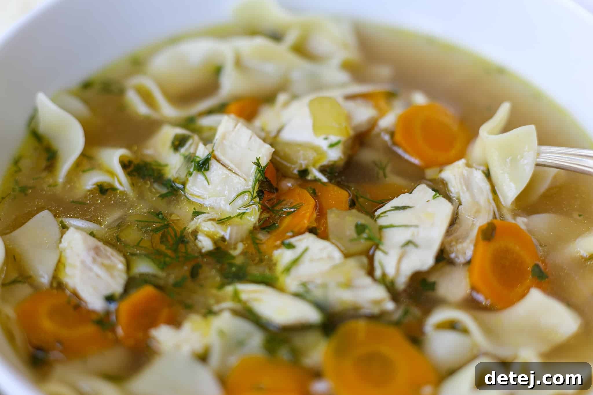 Ingredients for Bone Broth Chicken Noodle Soup laid out on a cutting board