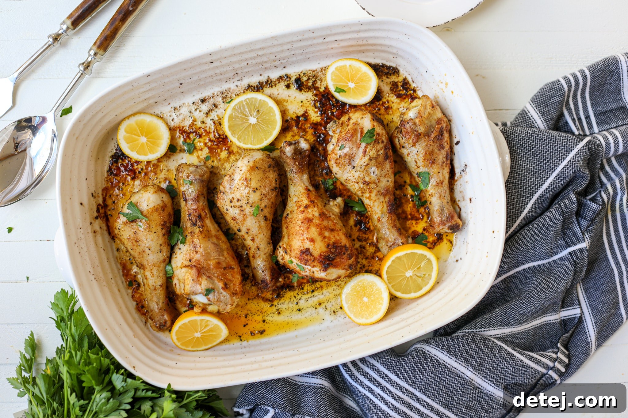 Golden brown baked chicken drumsticks arranged beautifully on a serving dish, ready to be enjoyed as a healthyish meal.