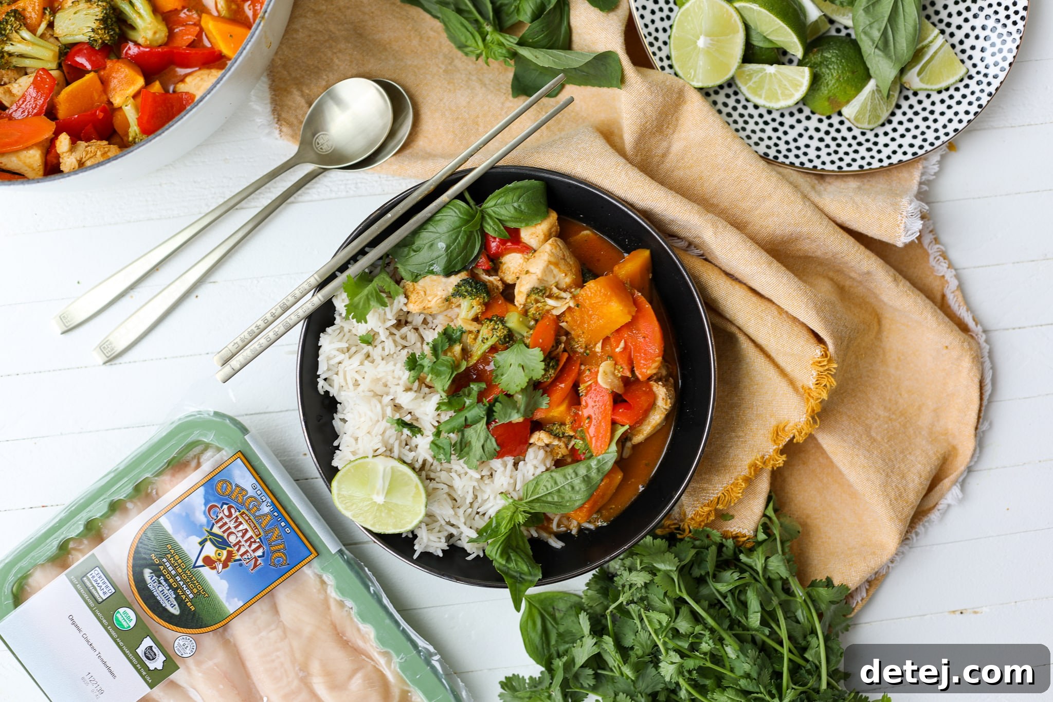 Close-up shot of the creamy Thai Red Curry Chicken and Vegetables, garnished with fresh herbs.