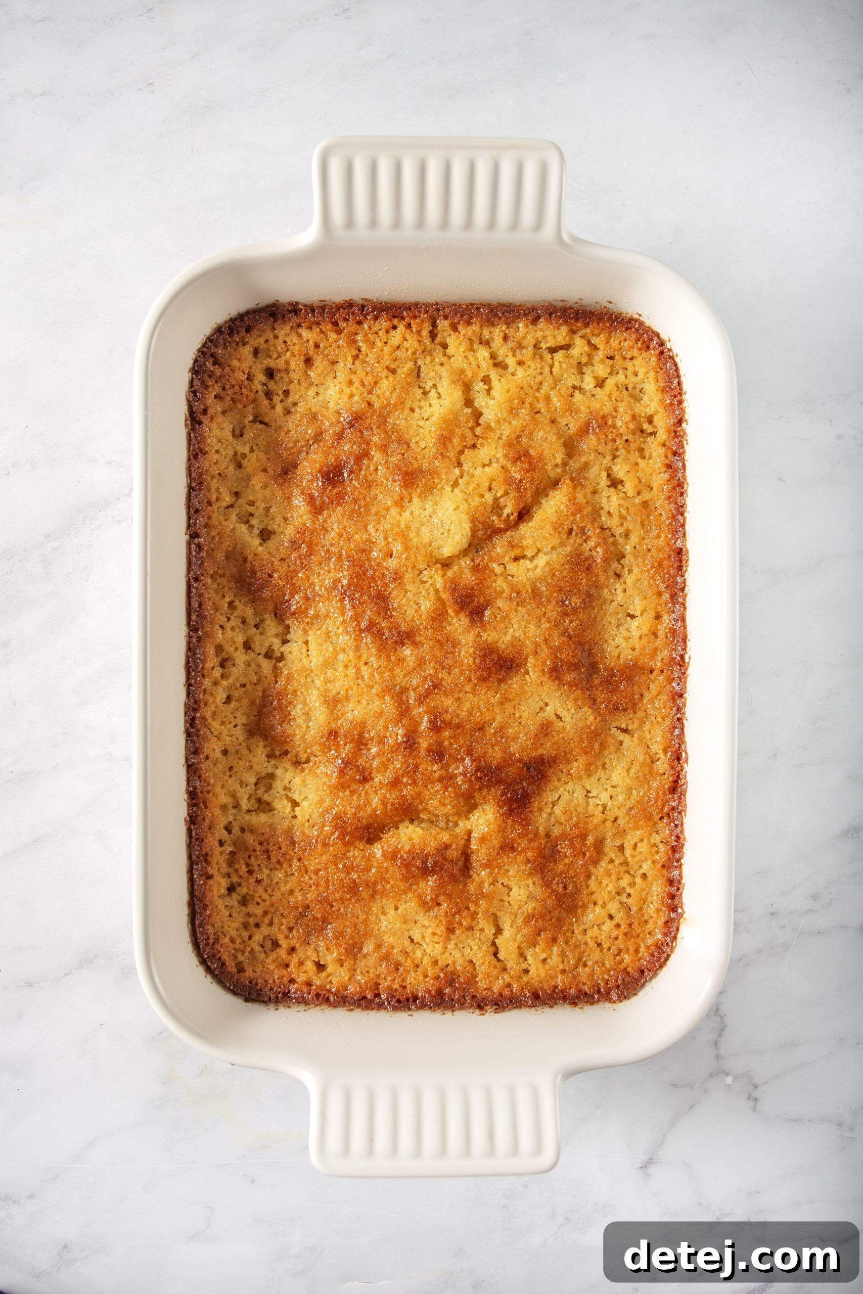 freshly baked honey cornbread in a cast iron skillet