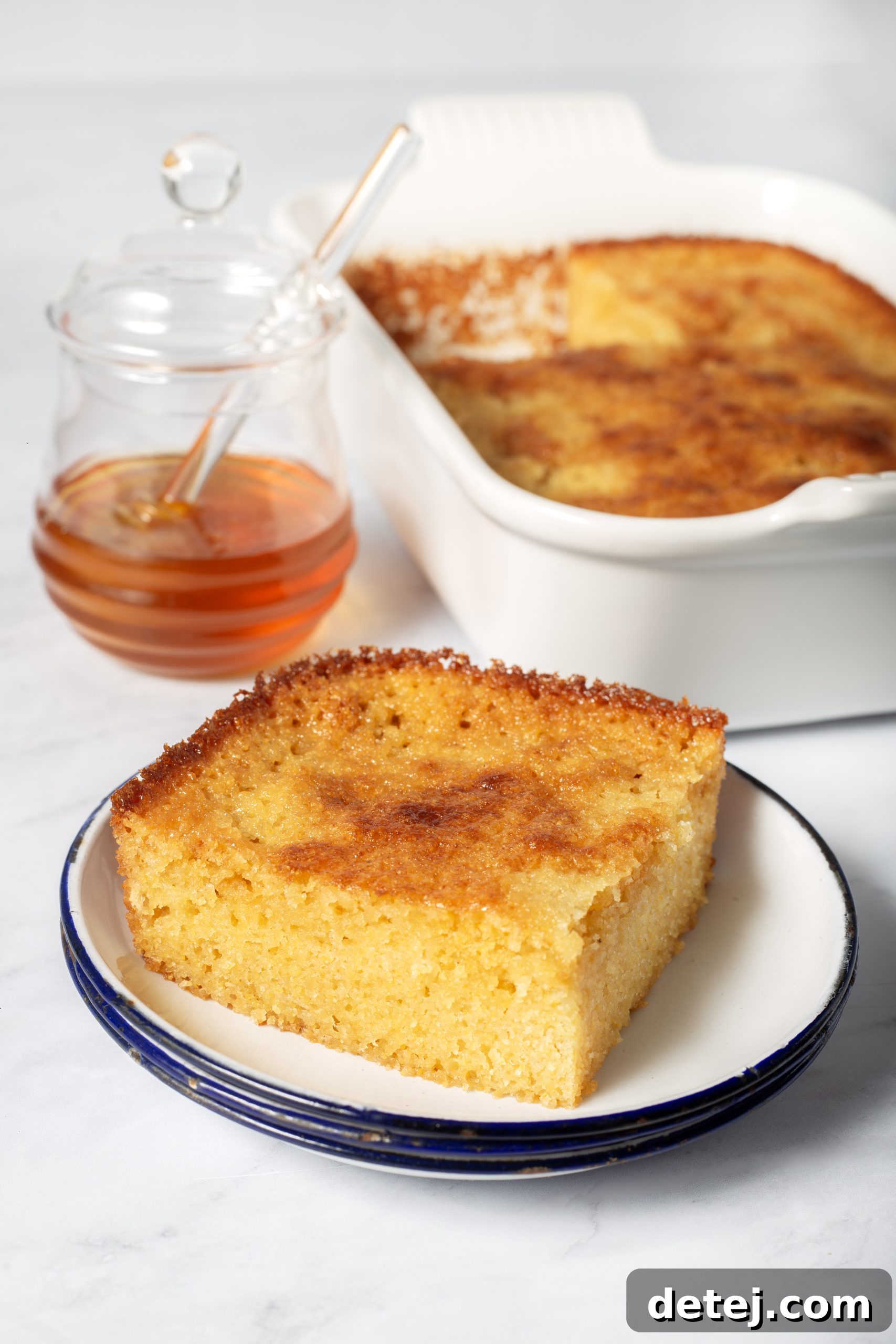 slice of honey cornbread with butter