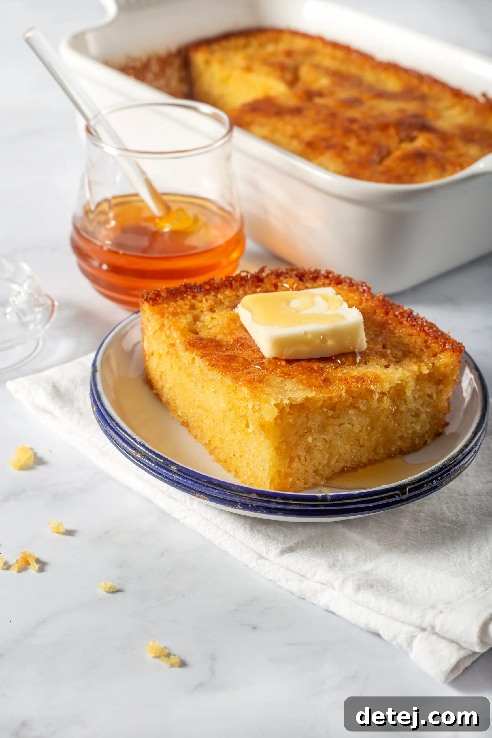 sliced honey cornbread on a cutting board