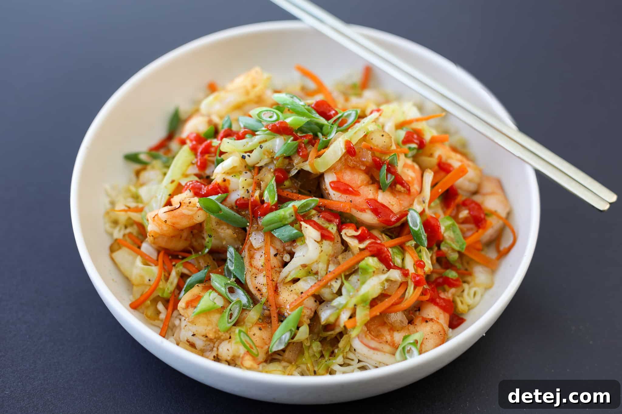 Egg Roll Stir-Fry Bowl 2 A vibrant Egg Roll in a Bowl dish, garnished with fresh green onions and sesame seeds, ready to be served.