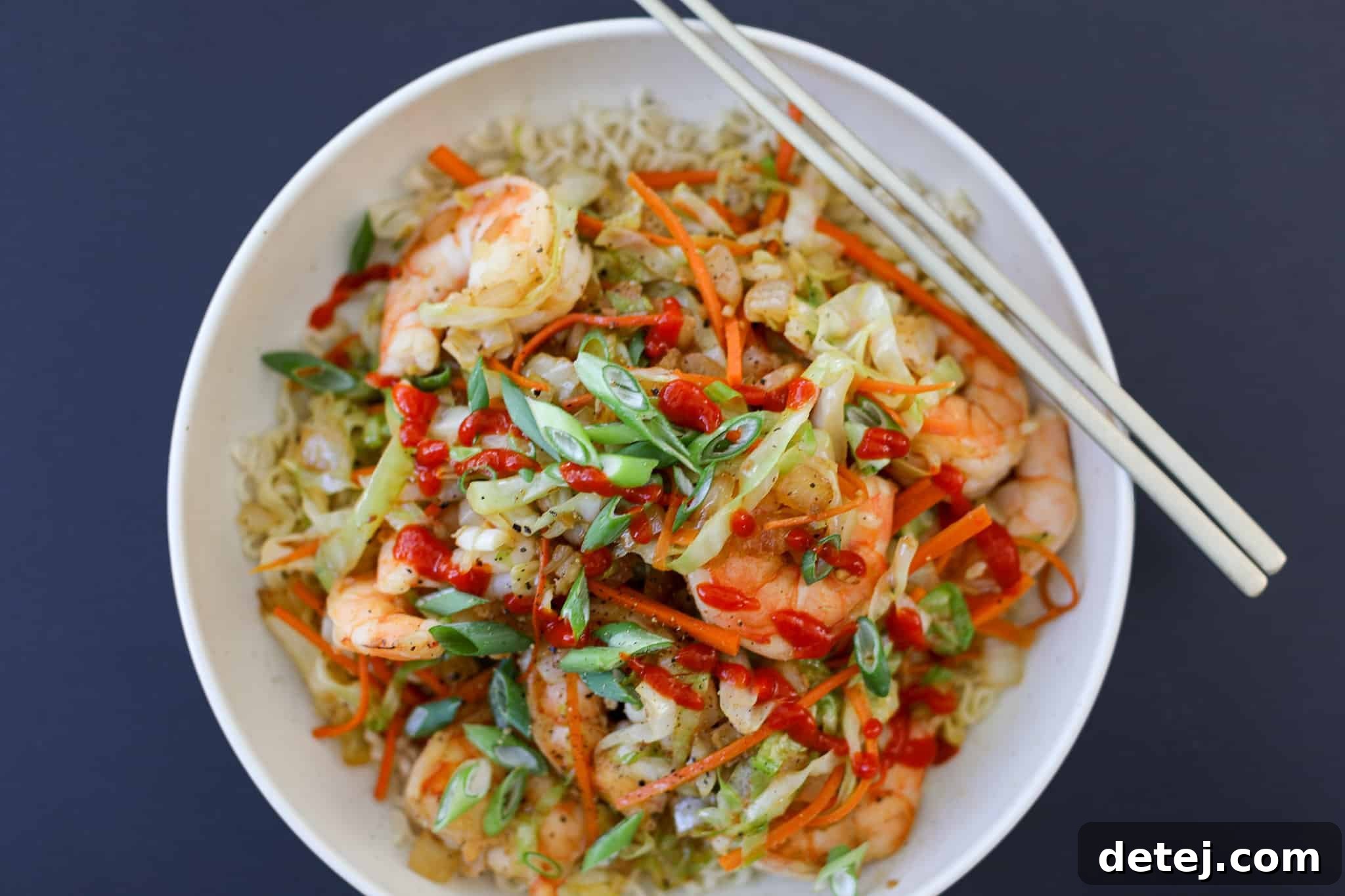 Egg Roll Stir-Fry Bowl 6 A beautifully plated Egg Roll in a Bowl, garnished with green onions and sesame seeds, ready for enjoyment.