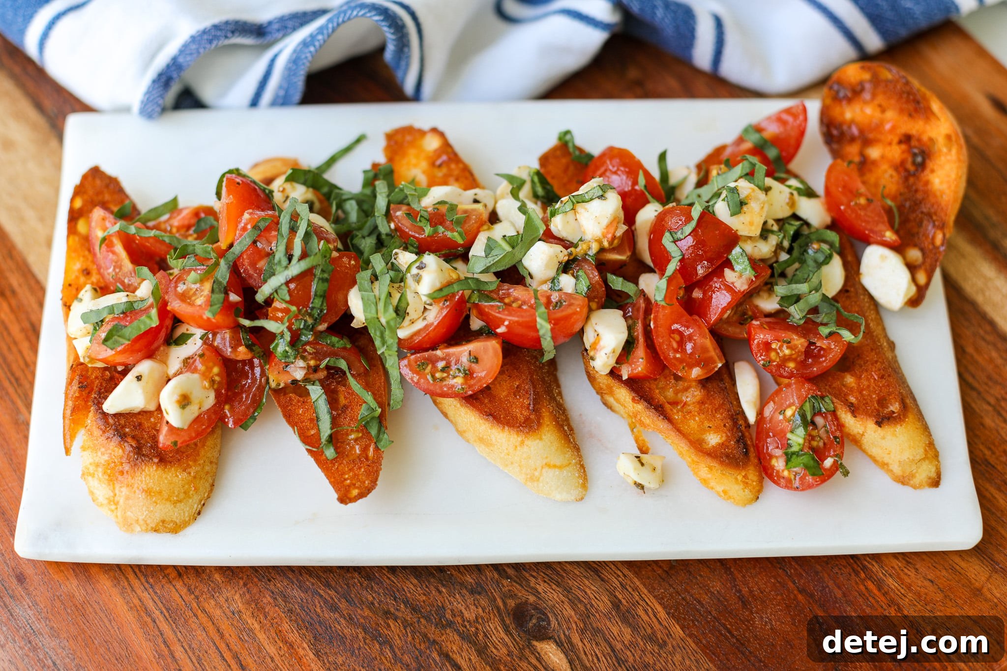 Platter of Spicy Bruschetta with Toasted Calabrian Butter Baguettes