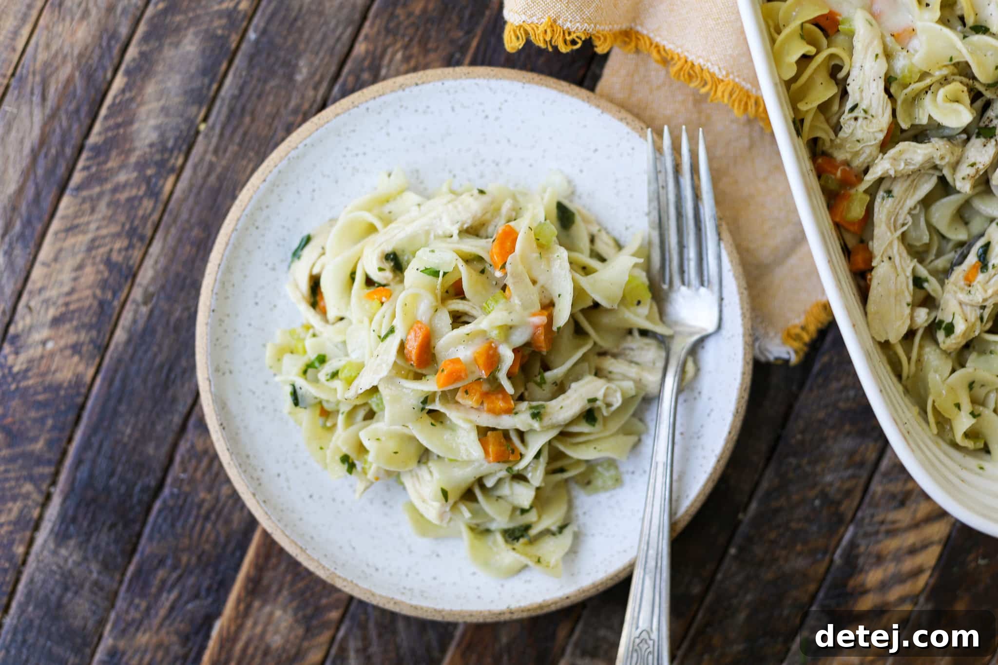Full baking dish of Chicken Noodle Soup Pasta Bake with a golden, bubbly cheese top, ready to serve.