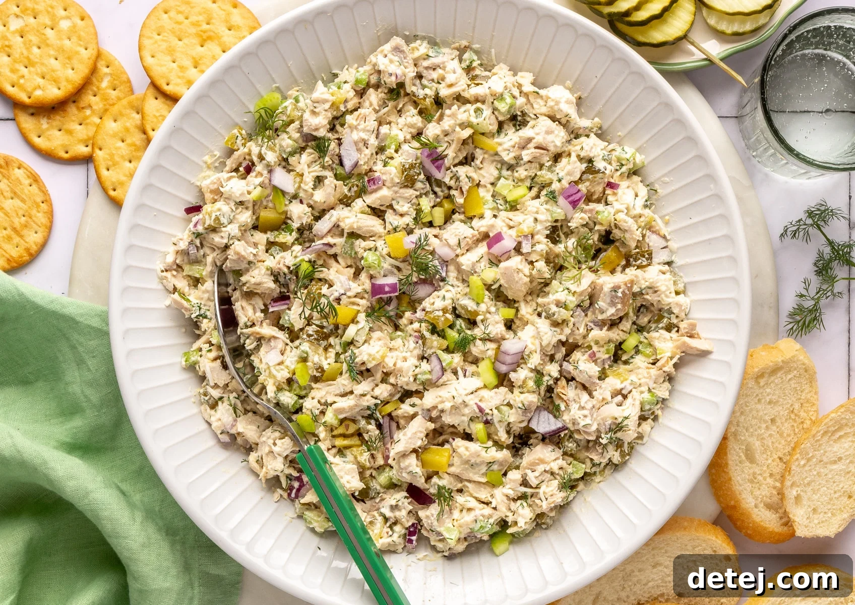 Finished dill pickle chicken salad in a elegant white bowl.