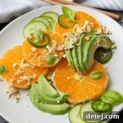 Avocado Citrus Salad on a plate, beautifully arranged.
