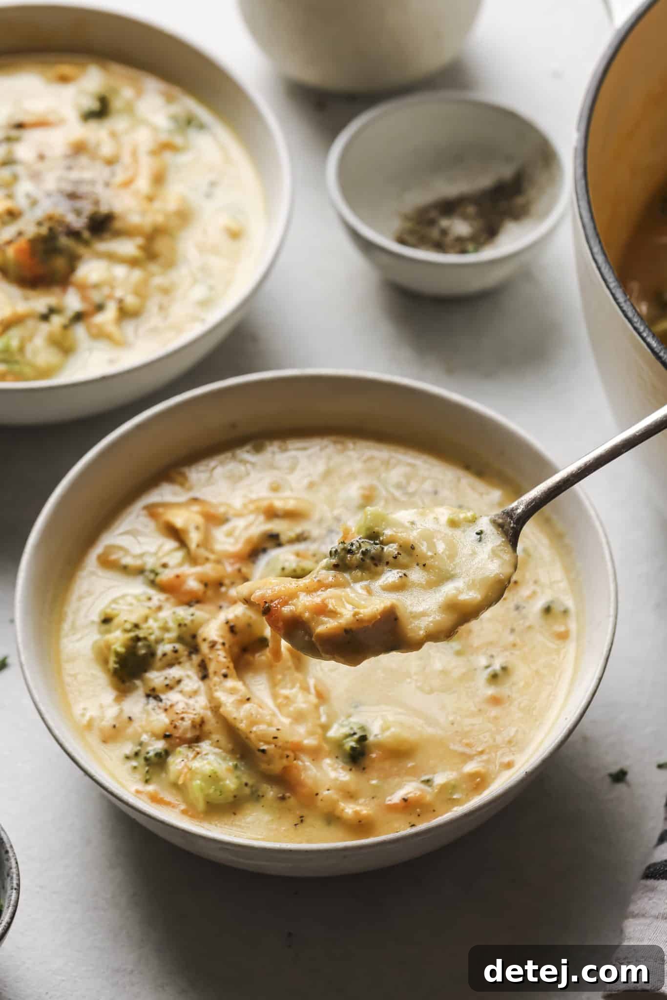An assortment of delicious, healthy soups served in various bowls, showcasing their inviting colors and textures.