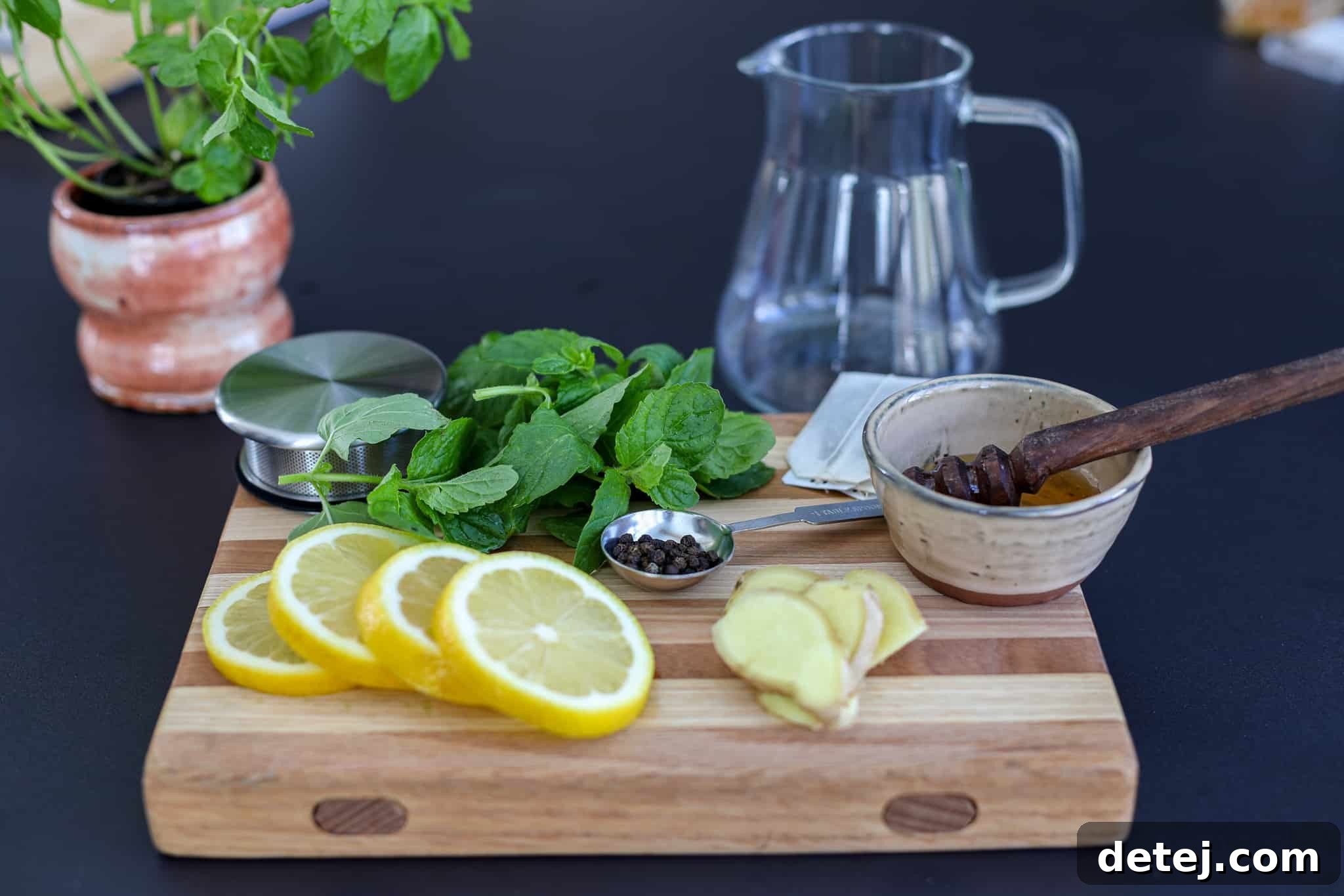Digestive Harmony Tea 2 A refreshing glass of Healthyish Digestion Tea with slices of lemon, ginger, and mint, promoting healthy living.