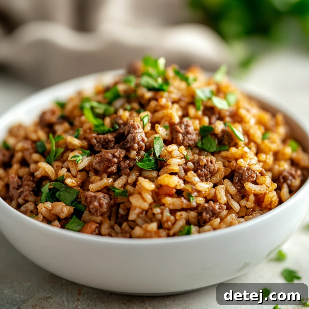 Southern Style Dirty Rice served in a bowl, garnished with green onions