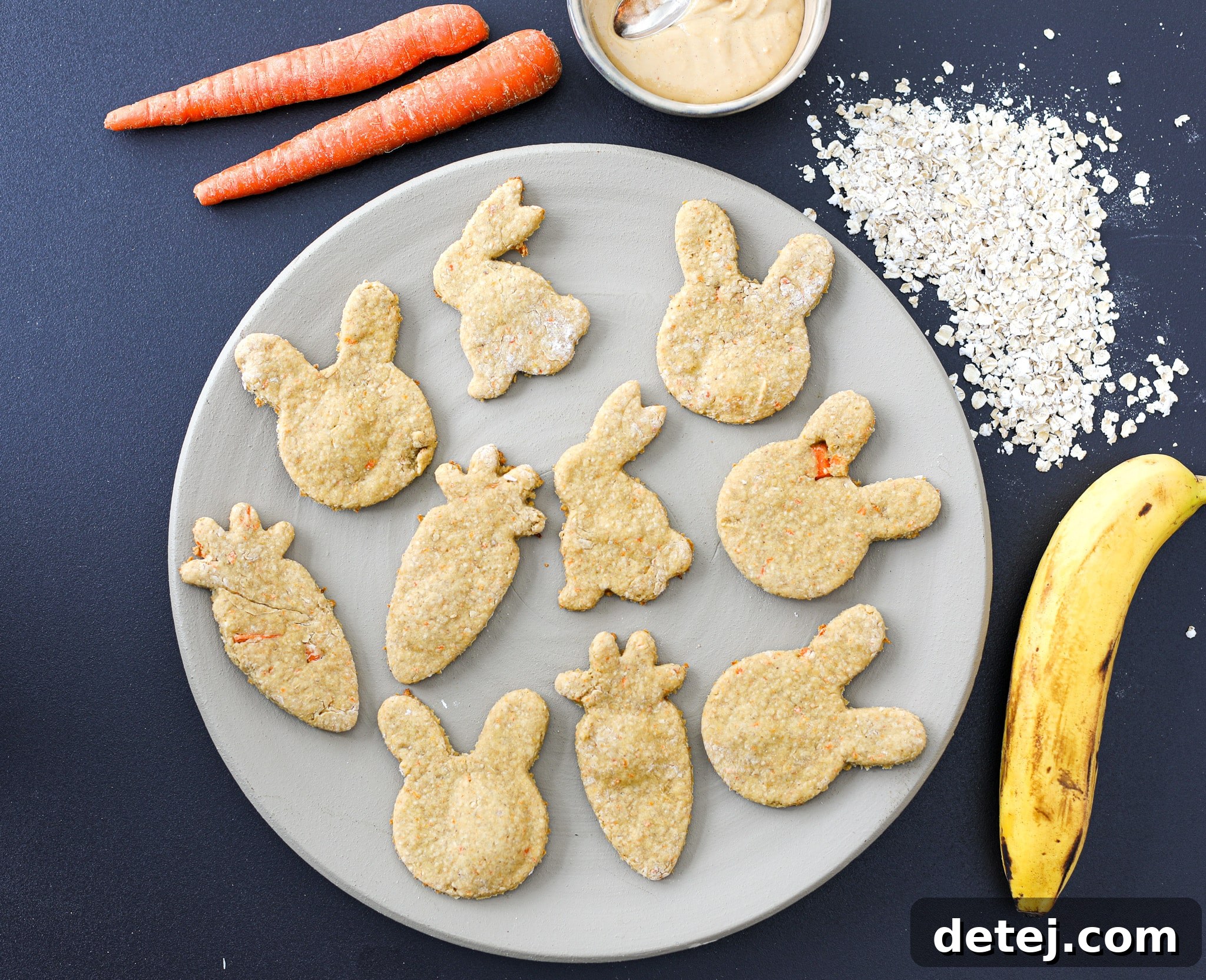 A batch of freshly baked, healthy homemade dog treats in various cute shapes, cooling on a rack, ready for your happy pup.