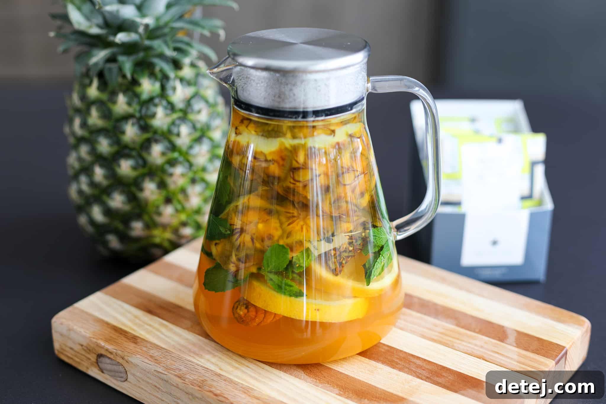 Pineapple Rind Infusion 2 Freshly brewed Pineapple Peel Infused Tea served in a glass, showcasing the vibrant golden hue and natural ingredients.