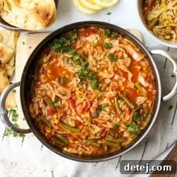 Savory Cabbage Soup with Tender Orzo 4 A top-down view of a steaming bowl of homemade Cabbage Soup with Orzo Pasta, garnished with fresh parsley, ready to be enjoyed.