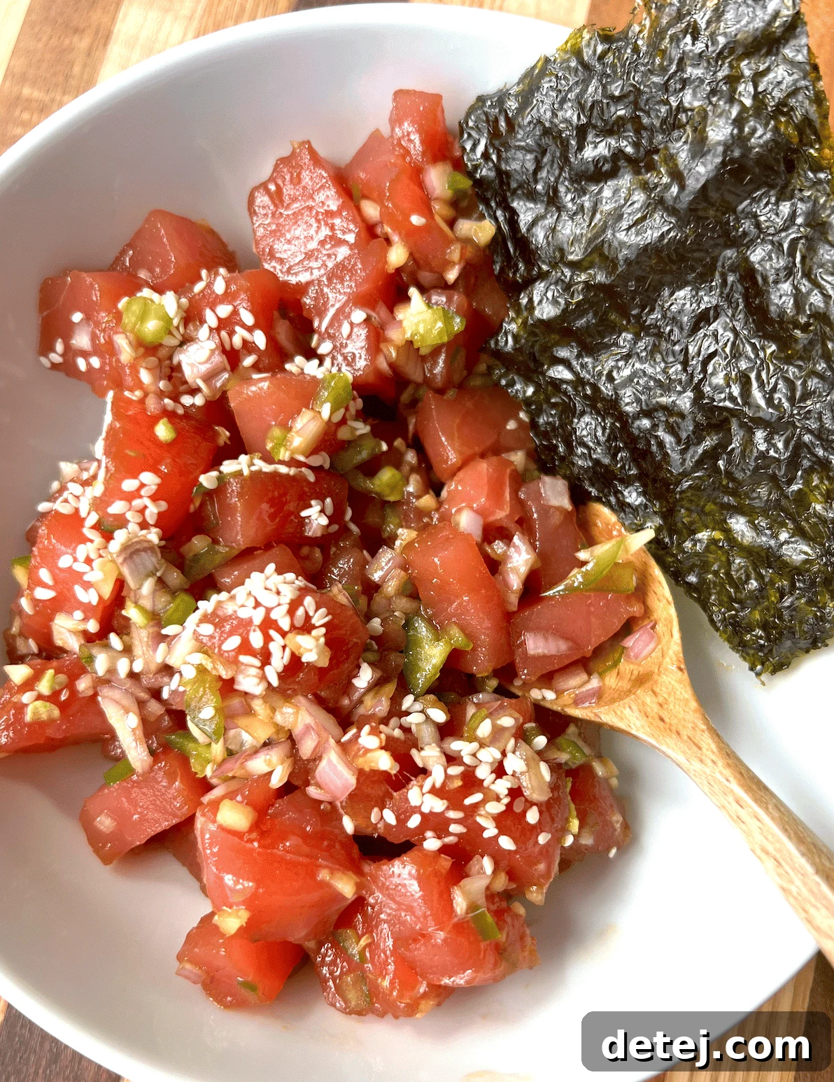Close-up of diced Ahi tuna, shallots, jalapeño, and ginger for poke.