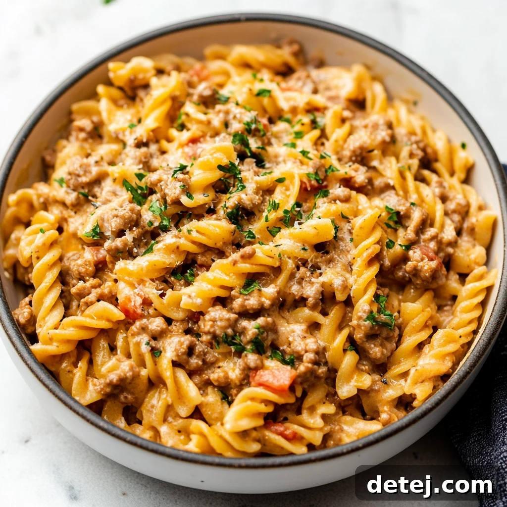 Creamy Ground Beef Skillet Pasta 4 Close-up of a portion of Stovetop Creamy Ground Beef Pasta, showing the texture of the sauce and beef.