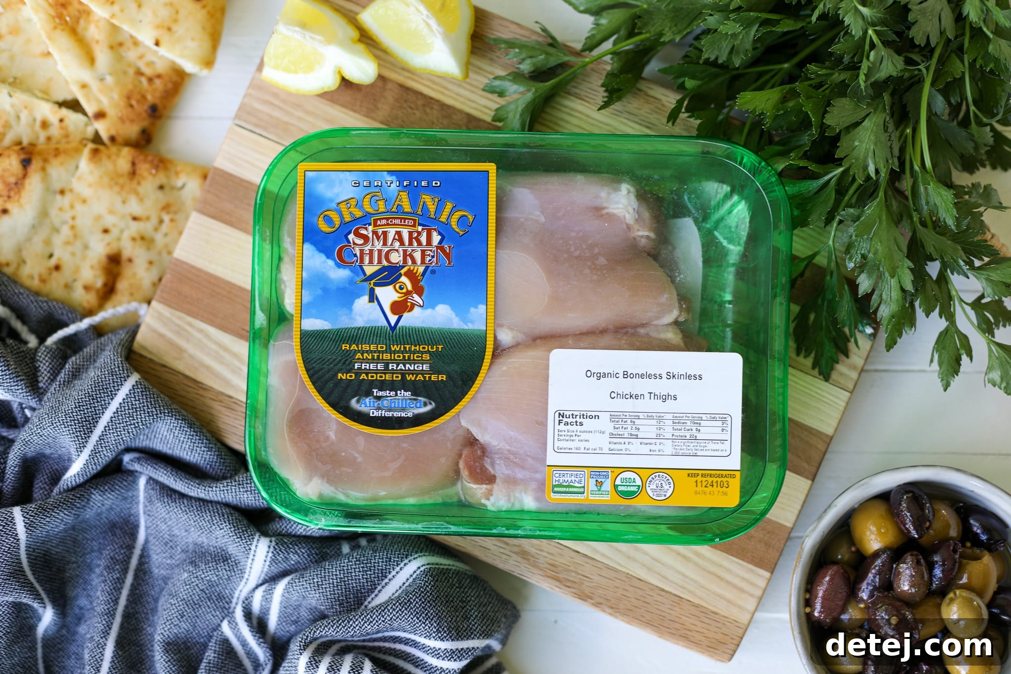 Smart Chicken packaging and raw chicken thighs, emphasizing quality.