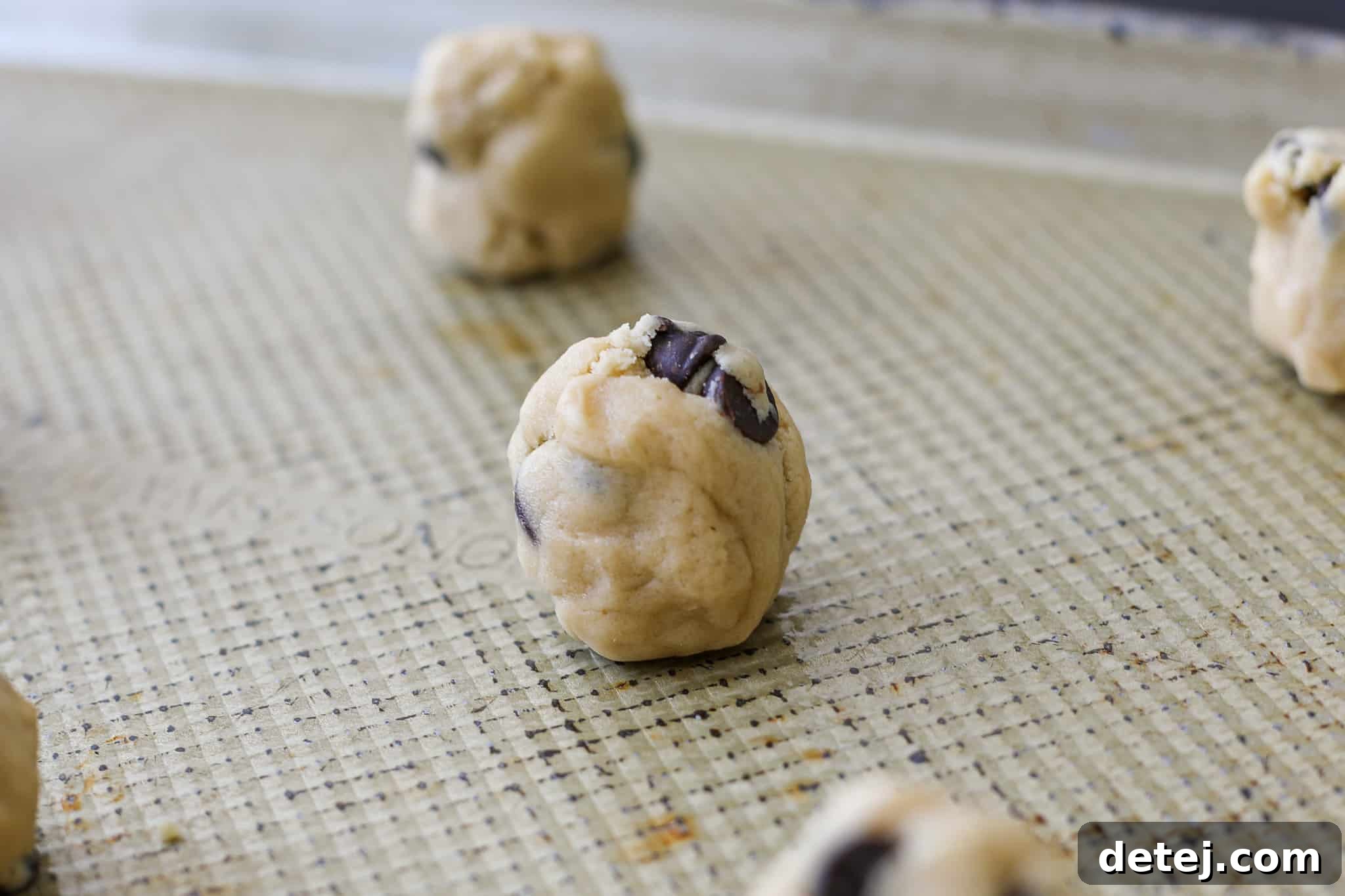 dough rolled into a tater tot shape before baking
