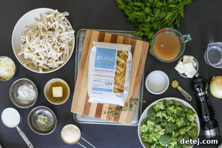 A beautiful display of fresh ingredients needed for a delicious chicken broccoli pasta bake.