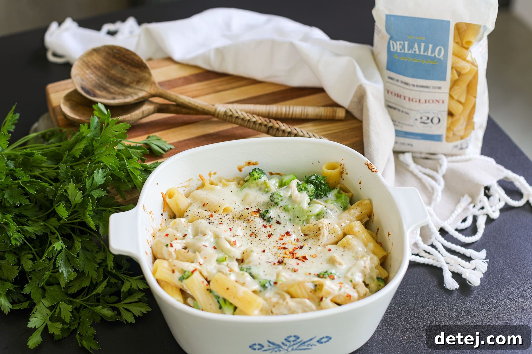 A close-up of the delicious baked chicken broccoli pasta, golden and bubbly.