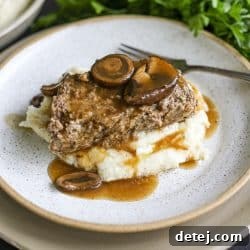 Plated Marry Me Meatloaf with mushroom gravy, ready to serve.