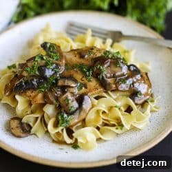 Skillet chicken with mushroom gravy over egg noodles.