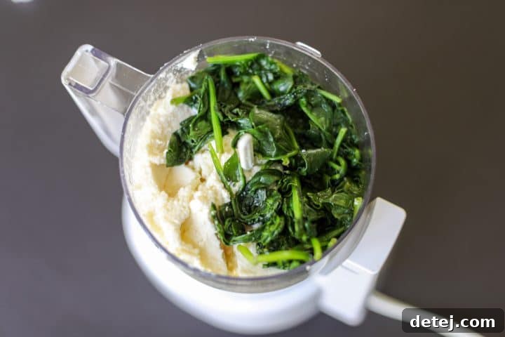 wilted spinach and drained ricotta cheese in a blender.