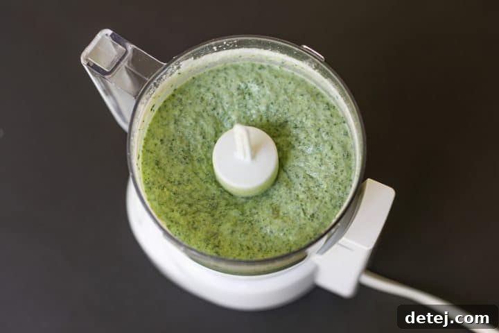 blended ricotta cheese and spinach, smooth and creamy, in a blender.