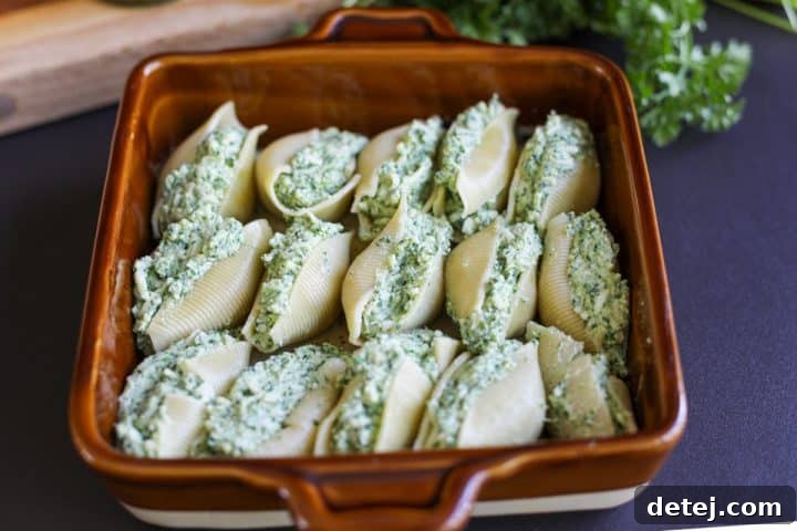 baking dish with stuffed shells arranged neatly inside.