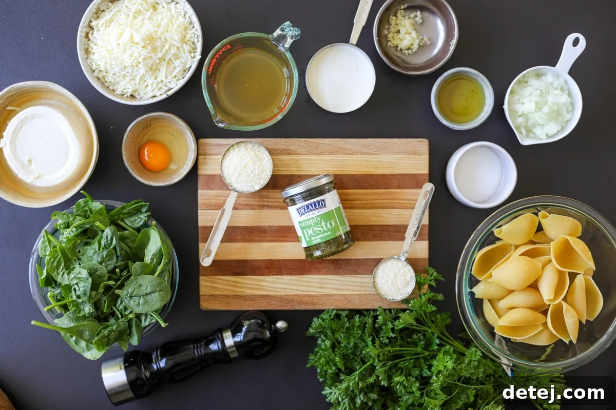 ingredients needed for pesto whipped ricotta stuffed shells, neatly arranged.
