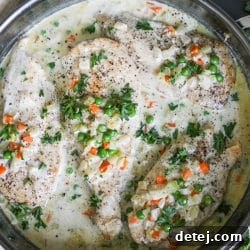 Creamy Chicken and Vegetables in a pan, ready to serve.