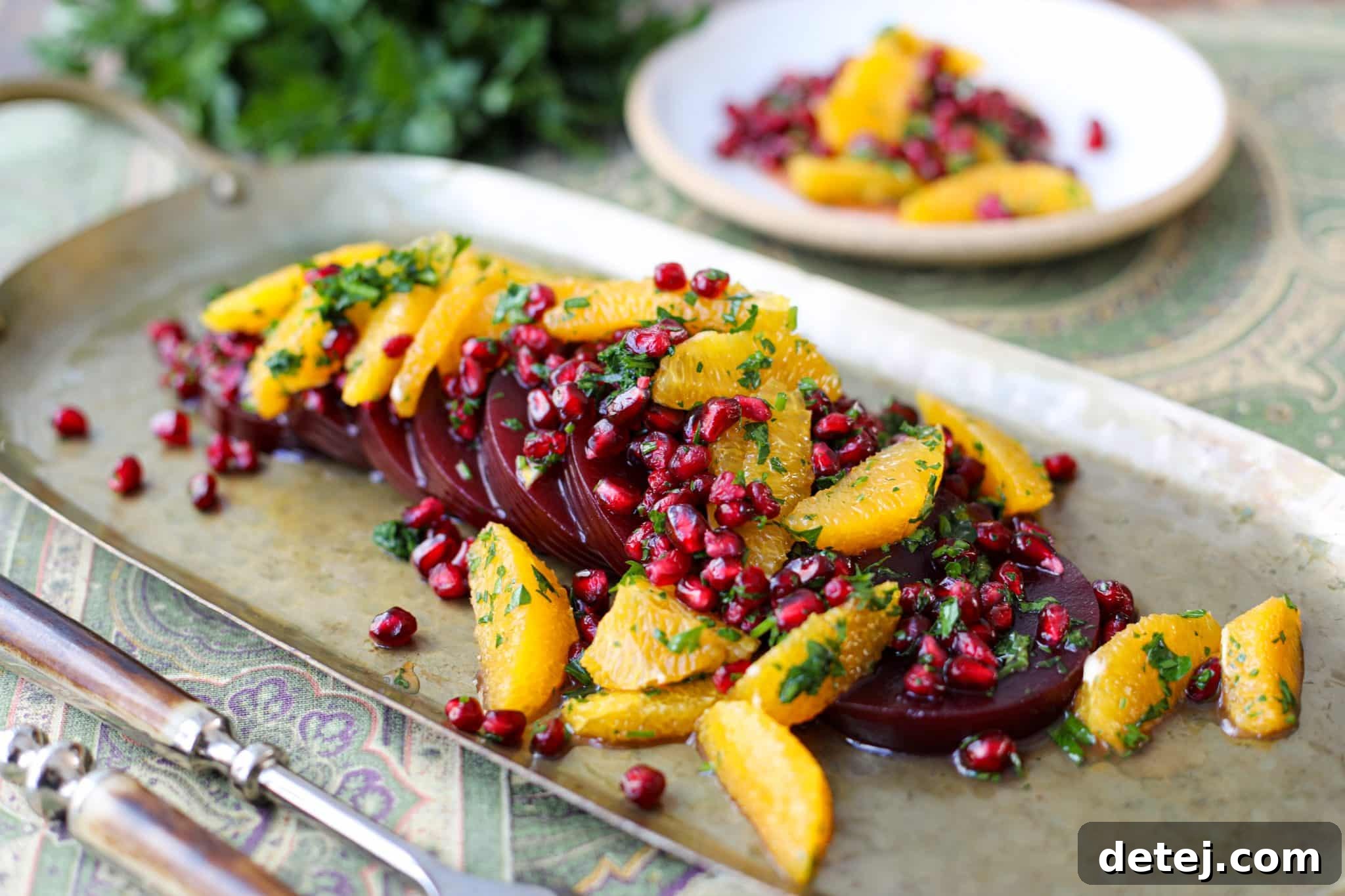 Fresh cranberry sauce in a bowl, garnished with orange slices.