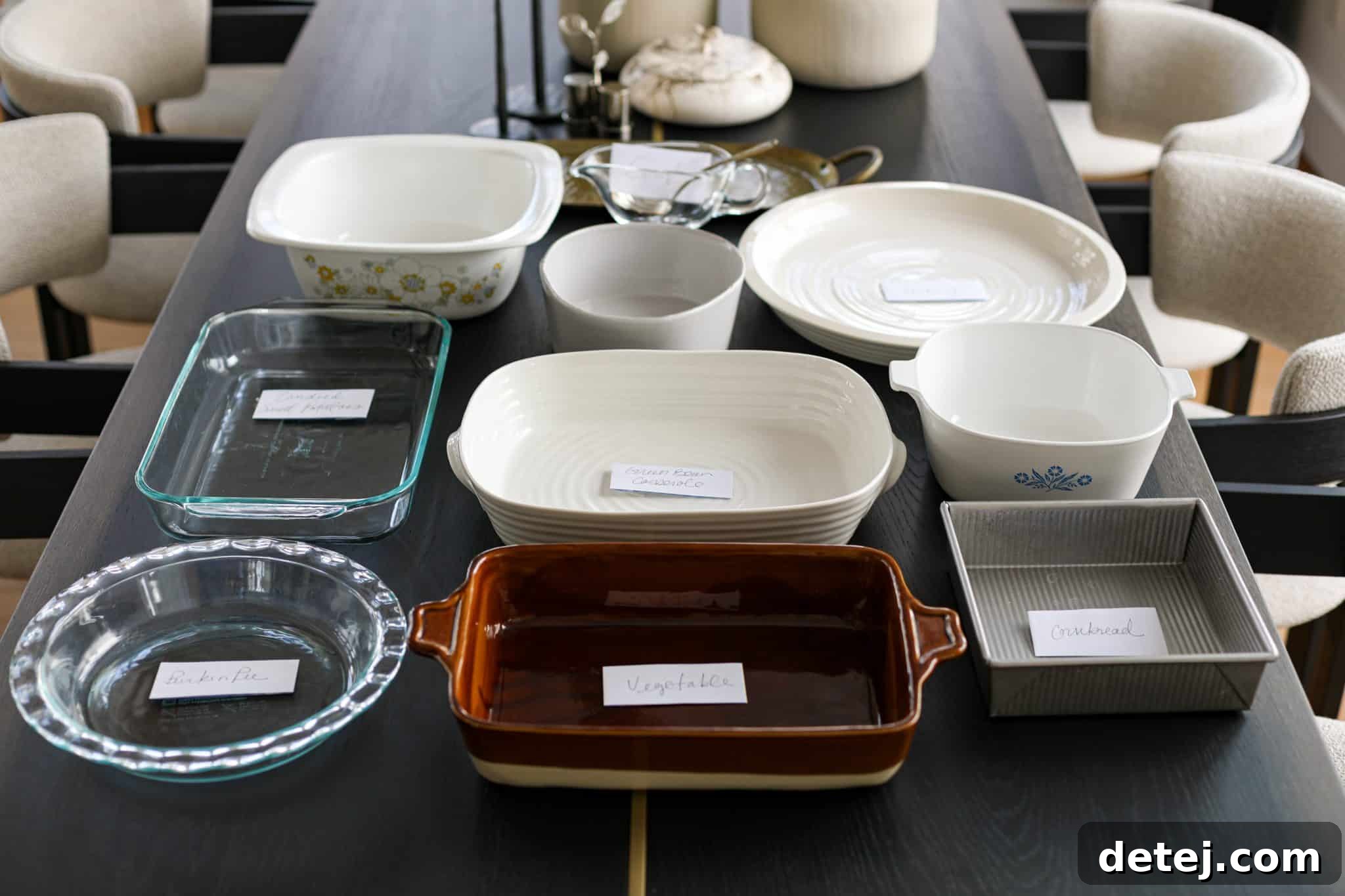 Assortment of cookware on a wooden table, ready for holiday meal preparation.