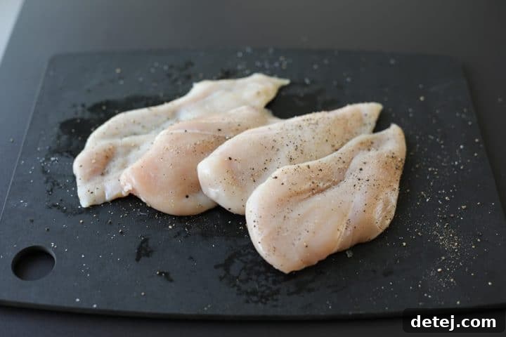 Chicken breasts carefully butterflied into four thin cutlets and seasoned with salt and pepper.