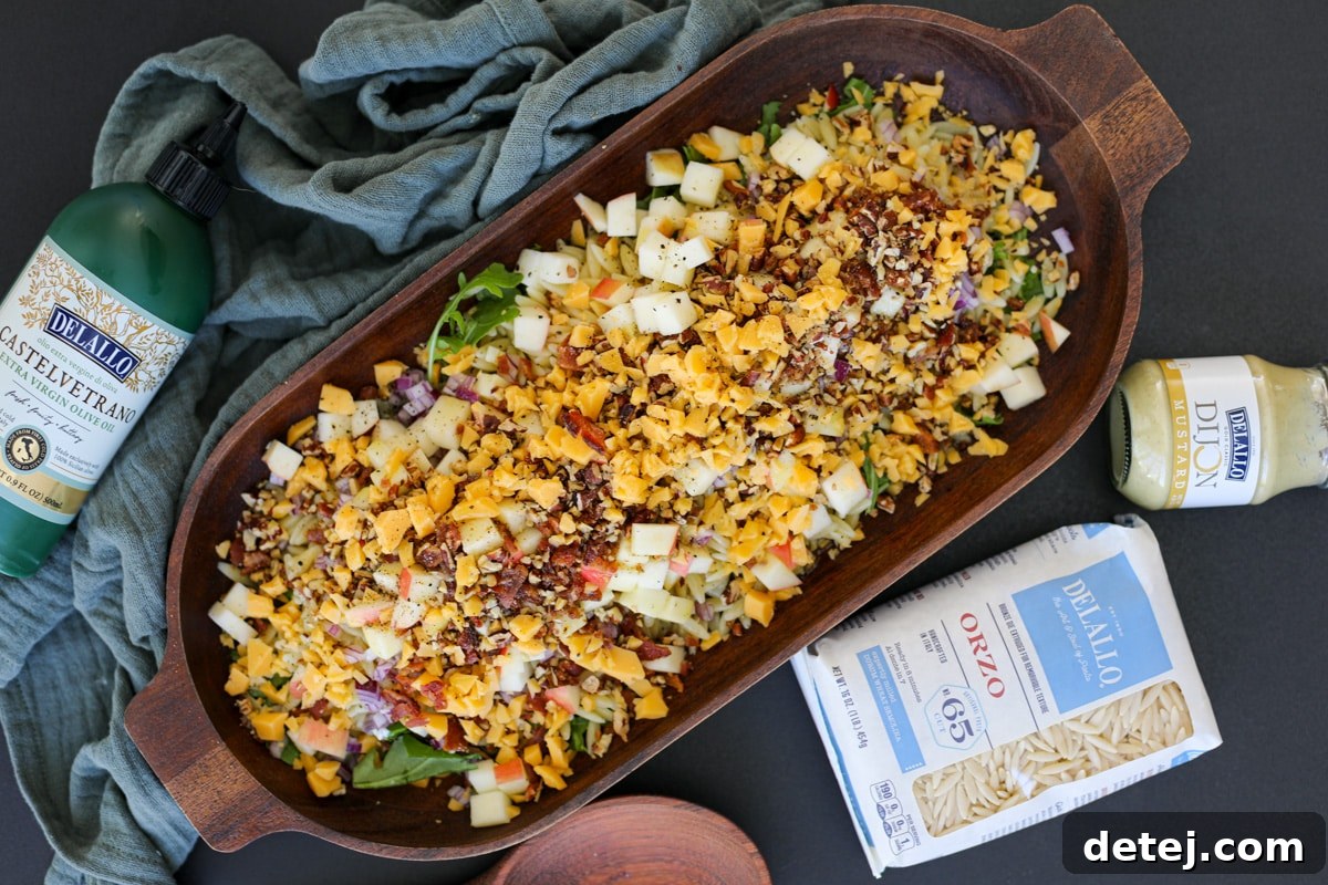 The Chopped Fall Pasta Salad in a rustic wooden bowl, ready to be enjoyed as a perfect autumn dish.