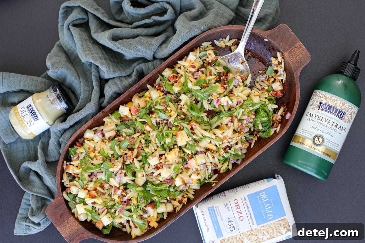 A large serving bowl filled with the colorful Chopped Fall Pasta Salad, ready to be served.