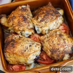 oven baked chicken thighs hot from the oven.