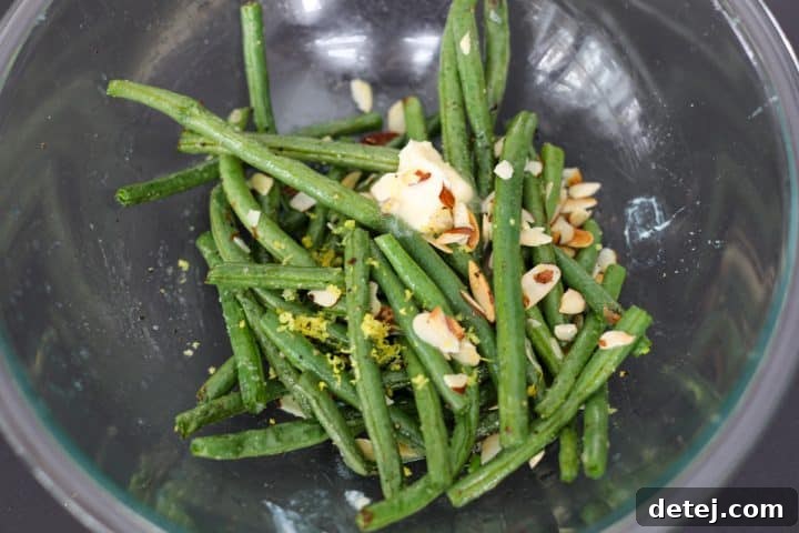 cooked green beans with butter, lemon zest and lemon juice.