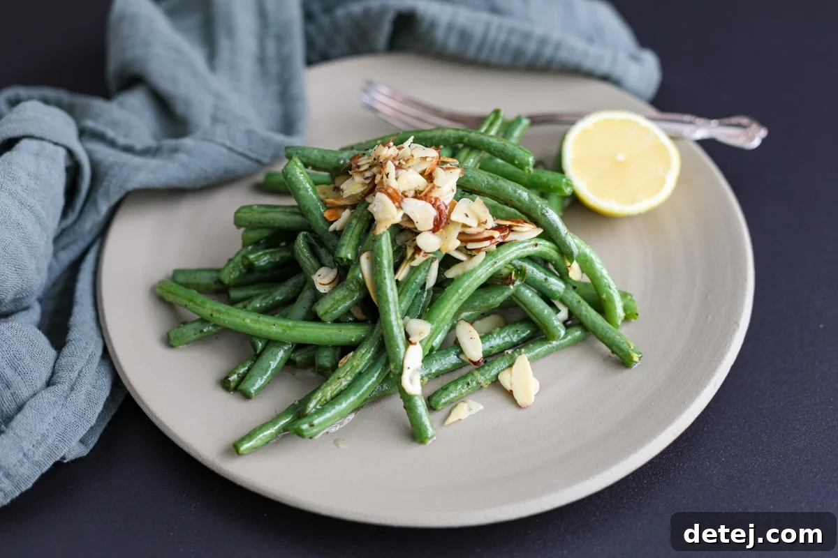 green beans plated with lemon.