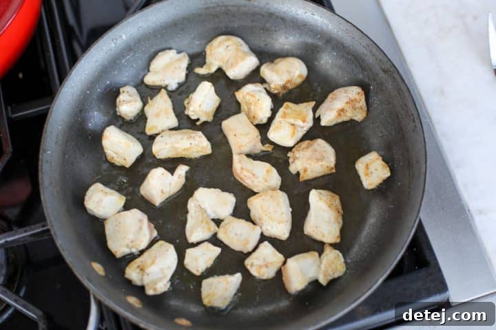 chicken cooking in a pan. 