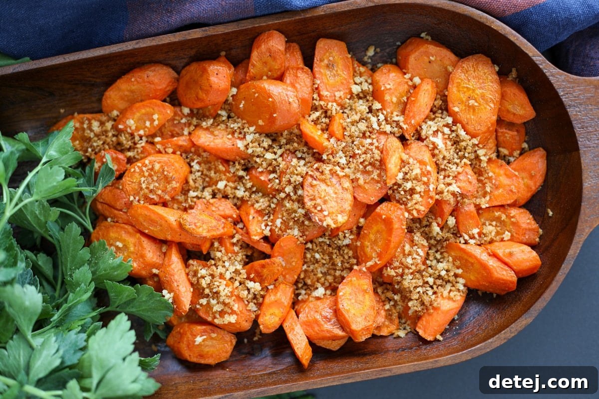 Roasted carrots with toasted panko breadcrumbs in a serving dish, ready to be enjoyed.