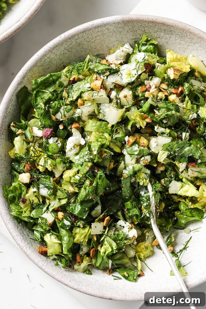 A beautifully presented Chopped Greek Salad, fresh and inviting, with a focus on vibrant colors and textures. - Healthyish Foods