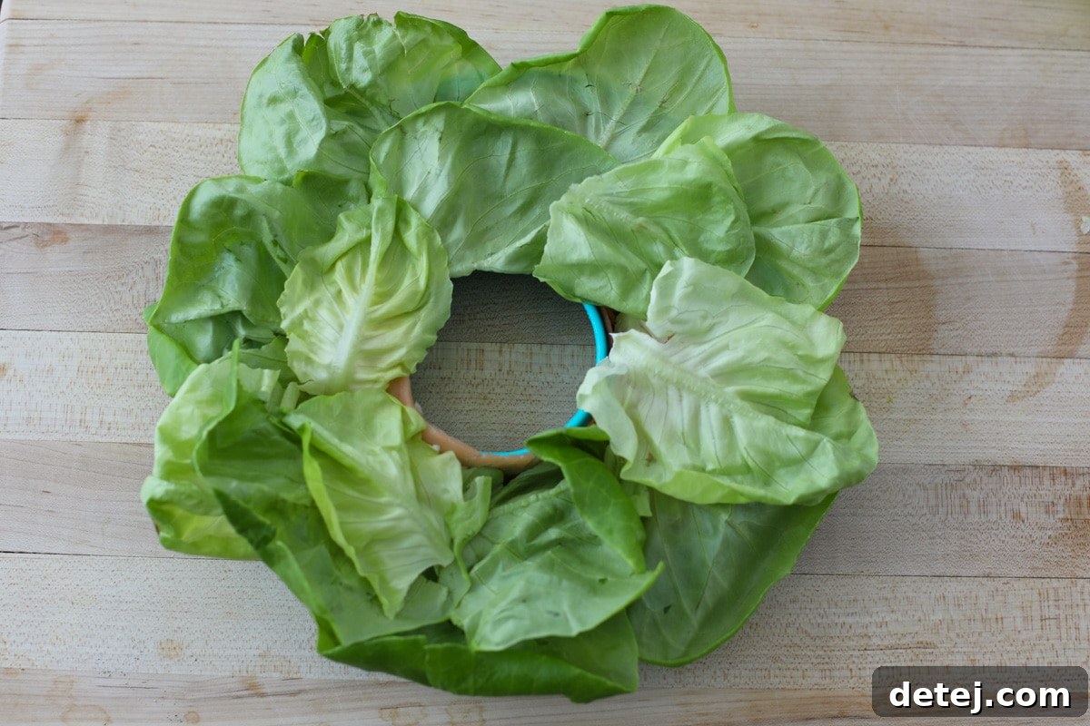 The chilled smoked salmon ring, now inverted onto a serving platter and surrounded by fresh butter lettuce.